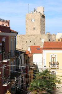 a view of a building with a clock tower at Ruffini Rooms in Termoli
