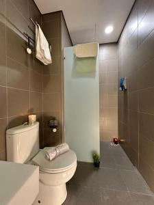 a bathroom with a toilet and a shower at KLCC Dorm (7 min walking to Twin Towers) in Kuala Lumpur