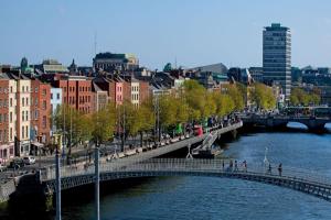 a bridge over a river in a city with buildings at Wellington Temple Bar in Dublin