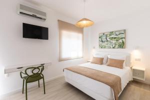 Postel nebo postele na pokoji v ubytování Faro Guest Apartments