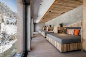 Łóżko lub łóżka w pokoju w obiekcie Das Central – Alpine . Luxury . Life