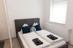 Postel nebo postele na pokoji v ubytování Berzsenyi Apartmanház