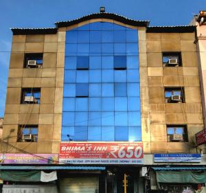 a tall building with windows on the side of it at BHIMAS INN -Puratchi Thalaivar Dr M G Ramachandran Central Railway Station Chennai in Chennai