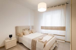 En eller flere senge i et værelse på Sunway Apartments