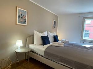Posteľ alebo postele v izbe v ubytovaní Retro-Chic Wohnung in der Bregenzer Fußgängerzone