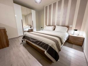En eller flere senge i et værelse på La Rosa dei Venti con parcheggio e ampio giardino in centro