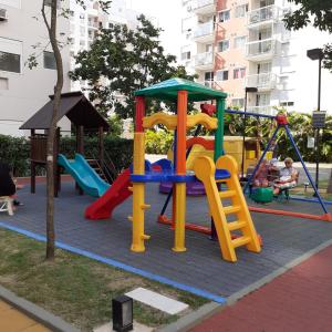 a playground with a slide and a play structure at Canto do sabiá in Rio de Janeiro