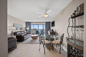 a living room with a table and chairs and a couch at Ocean View Condo, Beach Access, Pools, Views in Myrtle Beach