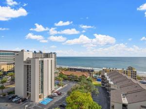 a view of the ocean from the balcony of a resort at Ocean View Condo, Beach Access, Pools, Views in Myrtle Beach