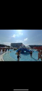 a group of people in a pool of water at De Lux Nedeljkovic President in Jagodina