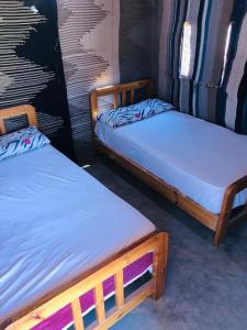מיטה או מיטות בחדר ב-Magic land taba camp