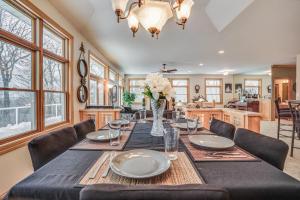 a dining room with a long table and chairs at Spacious Red Wing Home Near Parks and Biking! in Red Wing