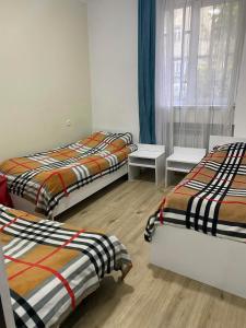 Postel nebo postele na pokoji v ubytování Apartments Lezzet