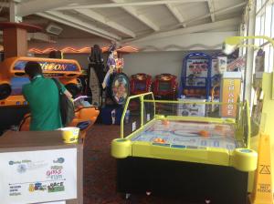 a man is standing in a room with a play equipment at Ritz Summerhouse in Hastings