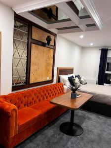 a living room with a couch and a bed at 53 Luxury Rooms in Maynooth