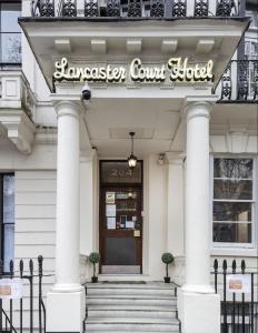 a building with a sign for the hawker court hotel at Lancaster Court Hotel in London