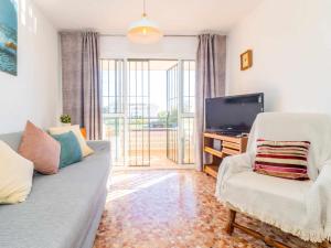 Televízia a/alebo spoločenská miestnosť v ubytovaní Mshome Casa Playa