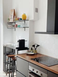 a kitchen with a counter and a stove top oven at Marina Motel in Marseille