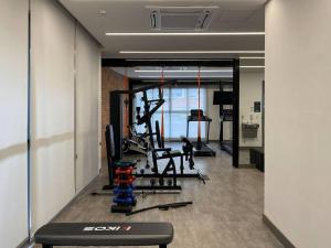 a room with a gym with equipment in it at Apt. inteiro recém-reformado - Jabaquara in Sao Paulo