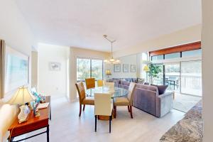 a living room with a table and a couch at Turnberry Village 258 in Hilton Head Island