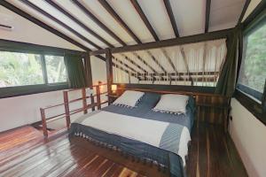 Una cama o camas en una habitación de Nahouse Jungle Lodges