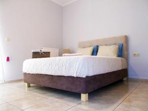 Кровать или кровати в номере Stelia Apartment