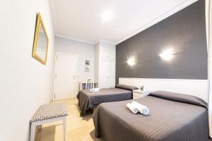 Postel nebo postele na pokoji v ubytování Hostal Ya