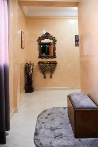 a bathroom with a sink and a mirror on the wall at Luxe Appartement a marrakech in Marrakech