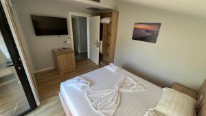 Postel nebo postele na pokoji v ubytování Villa Tramonto Vlore