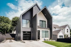 a house with a black and white facade at 25% OFF Weekly New Cozy 4B EVcharger Gym The Haus in Austin