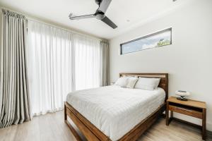 a bedroom with a bed and a large window at 25% OFF Weekly New Cozy 4B EVcharger Gym The Haus in Austin