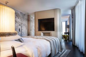 Postel nebo postele na pokoji v ubytování Hotel Topazz & Lamée
