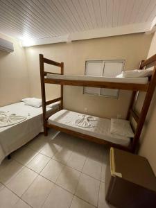 Postel nebo postele na pokoji v ubytování Morro de São Paulo Hospedagens
