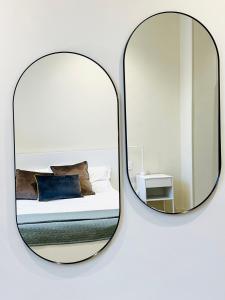 A bed or beds in a room at Palazzo Polini Apartments