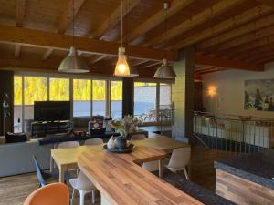 a living room with a wooden table and chairs at International House Sölden Superior Suit Penthouse in Sölden