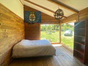 Ένα ή περισσότερα κρεβάτια σε δωμάτιο στο Hacienda Totoral - Frutillar