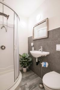 a bathroom with a sink and a toilet and a shower at Private Room & Private full Bathroom 3min Walk To UCSD in San Diego