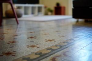 A bed or beds in a room at Palazzo Polini Apartments