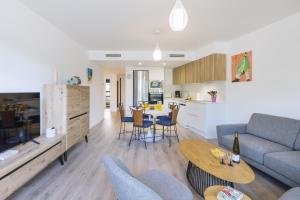 a living room with a couch and a table at Essential by Charlie in Jávea