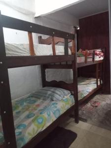 a couple of bunk beds in a room at Casinhas no Interior de MG in Antônio Prado