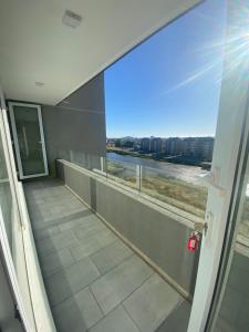 a balcony with a view of a river at Depto nuevo en brisas del sol in Talcahuano