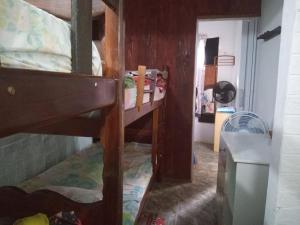 a room with two bunk beds and a hallway at Casinhas Interior Mg in Antônio Prado +146 photos