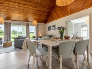 a dining room with a table and chairs at 3 Bed in St. Mellion 87716 in St Mellion