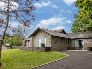 a large brick house with a driveway at 3 Bed in St. Mellion 87716 in St Mellion