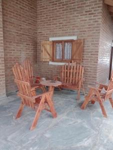 a room with two chairs and a table at Casa Grande in Las Grutas