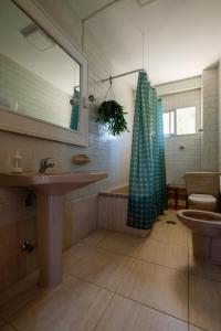 a bathroom with a sink and a shower and a toilet at Casa del Abuelo Isla Canela in Isla Canela +53 photos