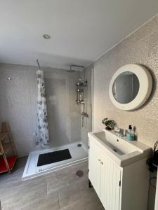 a bathroom with a white sink and a shower at El Cortijo Bungallows in Playa de las Americas +14 photos