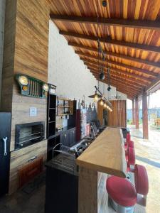 a kitchen with a wooden ceiling and a counter top at recanto do sossego. in Sinop