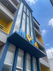a building with a n sign on top of it at Mova Express Hotel - CAMPINAS in Campinas