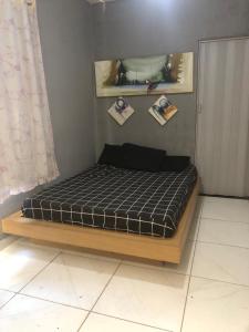 מיטה או מיטות בחדר ב-Kitnet dos Alves